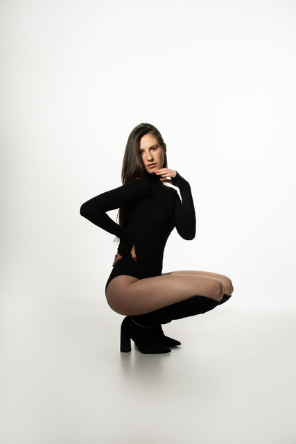 Confident Black Turtleneck Bodysuit & Boots: Minimalist Studio Styling Reference Photo Set