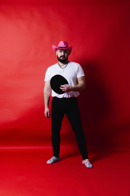 Bold Pink Cowboy Hat & Black Jeans Studio Styling: Urban Edge Fashion Photoshoot References