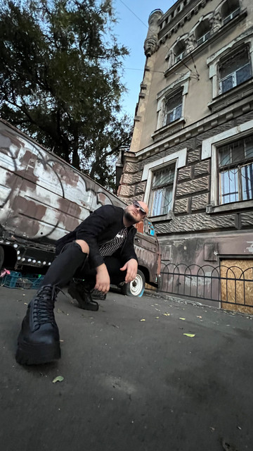Edgy Urban Streetwear Photo Set: Ripped Denim & Combat Boot Styling