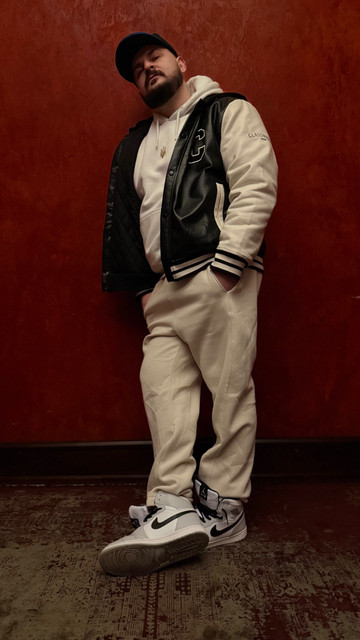 Confident Urban Streetwear: Layered Varsity Jacket Menswear lookbook-style set